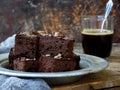 Pieces of cake chocolate brownies on wooden background. Homemade baking. Copy space Royalty Free Stock Photo