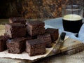 Pieces of cake chocolate brownies on wooden background. Homemade baking. Copy space Royalty Free Stock Photo