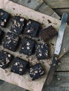 Pieces of cake chocolate brownies on wooden background. Homemade baking. Copy space Royalty Free Stock Photo