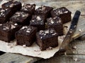 Pieces of cake chocolate brownies on wooden background. Homemade baking. Copy space Royalty Free Stock Photo