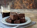 Pieces of cake chocolate brownies on wooden background. Homemade baking. Copy space Royalty Free Stock Photo