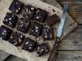 Pieces of cake chocolate brownies on wooden background. Homemade baking. Copy space Royalty Free Stock Photo