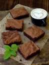 Pieces of cake chocolate brownies on wooden background. selective focus. Royalty Free Stock Photo