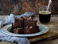 Pieces of cake chocolate brownies on wooden background. selective focus. Royalty Free Stock Photo