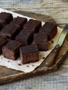 Pieces of cake chocolate brownies on wooden background. selective focus. Royalty Free Stock Photo