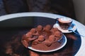 Pieces of cake. Drink hot chocolate cocoa coffee in cups. Black background.