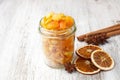 Pieces of candied orange peel coated in sugar in jar Royalty Free Stock Photo