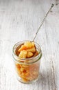 Pieces of candied orange peel coated in sugar in jar Royalty Free Stock Photo