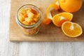 Pieces of candied orange peel coated in sugar in jar Royalty Free Stock Photo