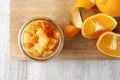 Pieces of candied orange peel coated in sugar in jar Royalty Free Stock Photo