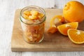 Pieces of candied orange peel coated in sugar in jar Royalty Free Stock Photo