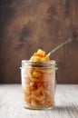 Pieces of candied orange peel coated in sugar in jar Royalty Free Stock Photo