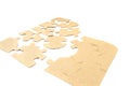 Pieces of cardboard puzzles isolated on white background