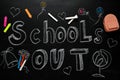 Pieces of chalk, stationery and text SCHOOL`S OUT written on blackboard, flat lay. Summer holidays