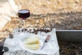 Pieces of cheese and raisins with a red wine glass on a old wood Royalty Free Stock Photo