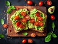 Pieces of cherry tomatoes on a rectangular slice of bread spread with avocado cream Royalty Free Stock Photo