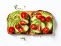 Pieces of cherry tomatoes on a rectangular slice of bread spread with avocado cream Royalty Free Stock Photo