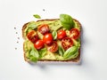 Pieces of cherry tomatoes on a rectangular slice of bread spread with avocado cream Royalty Free Stock Photo