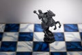 A pieces of chess character on the board with a light. A character represents strategy, planning, brave, betrayal, confrontation a Royalty Free Stock Photo