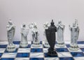 A pieces of chess character on the board with a light. A character represents strategy, planning, brave, betrayal, confrontation a Royalty Free Stock Photo