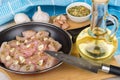 Pieces of chicken meat, spices, garlic and bottle of oil Royalty Free Stock Photo