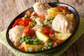 Pieces of chicken stew with potatoes, peppers, tomatoes, peas an Royalty Free Stock Photo