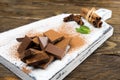 Pieces of chocolate, cinnamon, mint and star anise on a cutting Board. Royalty Free Stock Photo