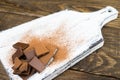 Pieces of chocolate, cinnamon, mint and star anise on a cutting Board. Royalty Free Stock Photo