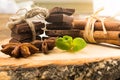 Pieces of chocolate, cinnamon, mint and star anise on the serving Board. Royalty Free Stock Photo
