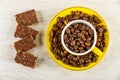 Pieces of chocolate, cup with coffee beans in saucer on wooden table. Top view Royalty Free Stock Photo