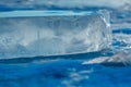 Pieces of clear blue ice of lake Baikal in the winter sunlight Royalty Free Stock Photo