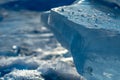 Pieces of clear blue ice of lake Baikal in the winter sunlight Royalty Free Stock Photo