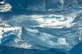 Pieces of clear blue ice of lake Baikal in the winter sunlight. Beauty of nature Royalty Free Stock Photo