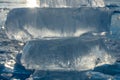 Pieces of clear blue ice of lake Baikal in the winter sunlight. Beauty of nature Royalty Free Stock Photo