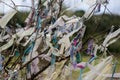 Pieces of cloths tied on branches of tree for wishing Royalty Free Stock Photo