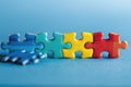 Pieces of a colorful puzzle on blue. ai generated