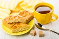 Pieces of cookies with marzipan, napkin, tea, teaspoon, sugar cu Royalty Free Stock Photo