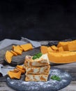 Pieces of cottage cheese pie and fresh pumpkin Royalty Free Stock Photo