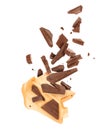 Pieces of crushed chocolate are fly out from a paper wrapper, isolated on a white background Royalty Free Stock Photo