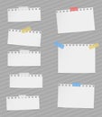 Pieces of cut out white notebook paper are stuck on gray striped background Royalty Free Stock Photo