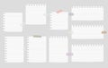 Pieces of cut out white notebook paper are stuck on gray striped background Royalty Free Stock Photo