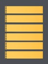 Pieces of cut yellow lined notebook paper, banners are stuck on dark gray background