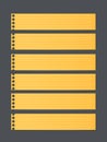 Pieces of cut yellow lined notebook paper, banners are stuck on dark gray background Royalty Free Stock Photo