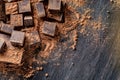 Pieces of dark bitter chocolate with cocoa powder on wooden background. Card with space for text