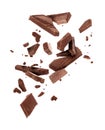 Pieces of dark chocolate falling close up on a white background Royalty Free Stock Photo