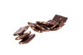 pieces of dark chocolate with nuts in a heap isolated on white background Royalty Free Stock Photo