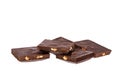 pieces of dark chocolate with nuts lie side by side isolated on white background Royalty Free Stock Photo