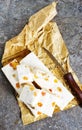 Pieces of delicious nutty nougat on table