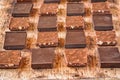 Pieces of different milk chocolate are carefully laid out in a staggered order Royalty Free Stock Photo