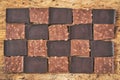 Pieces of different milk chocolate are carefully laid out in a staggered order Royalty Free Stock Photo